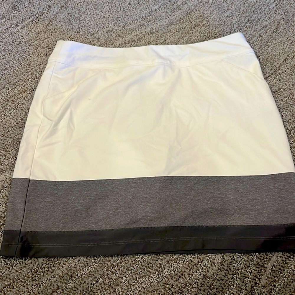 Golf skirt. Adidas. Attached shorts. Pockets.Excellent condition. Size small